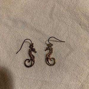 Gold colored seahorse dangling earrings